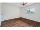 Spacious bedroom featuring a ceiling fan and wood flooring at 897 Mockingbird Ln, Brighton, CO 80601