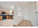 Kitchen and entryway features tile flooring, stainless steel appliances, and wood cabinets at 897 Mockingbird Ln, Brighton, CO 80601