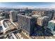 Aerial view of a modern high-rise building, close to city train station, offering an urban living experience at 1750 Wewatta St # 705, Denver, CO 80202