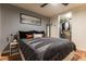 Cozy bedroom with a king bed, modern decor, and a walk-in closet at 1750 Wewatta St # 705, Denver, CO 80202