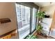 Wonderful city views from the interior with modern decor and plants at 1750 Wewatta St # 705, Denver, CO 80202