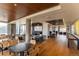 Spacious common area with hardwood floors, modern decor, and ample seating at 1750 Wewatta St # 705, Denver, CO 80202