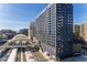 Modern high-rise building near city rail station featuring sleek architecture and an urban setting at 1750 Wewatta St # 705, Denver, CO 80202