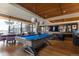 Bright game room featuring a billiards table, stylish seating, and expansive windows with city views at 1750 Wewatta St # 705, Denver, CO 80202