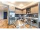 The modern kitchen boasts stainless steel appliances, dark backsplash, light wood cabinets, and an island at 1750 Wewatta St # 705, Denver, CO 80202