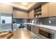 Modern kitchen features stainless steel appliances, sleek countertops, and stylish backsplash at 1750 Wewatta St # 705, Denver, CO 80202