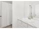 Clean bathroom featuring a single sink with a wide mirror and a shower and tub combination with a white curtain at 1678 Wright Aly, Erie, CO 80516