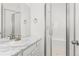 Clean bathroom featuring marble countertops and a glass-enclosed shower at 1678 Wright Aly, Erie, CO 80516