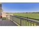 Relaxing deck overlooking a large open field providing serene views and a tranquil outdoor space at 1678 Wright Aly, Erie, CO 80516