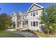 Inviting two-story townhome with covered porch and well-maintained landscaping at 1678 Wright Aly, Erie, CO 80516