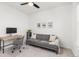 Cozy home office with gray sofa, desk and ceiling fan at 1678 Wright Aly, Erie, CO 80516