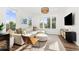 Inviting living room with modern decor, including a comfortable sectional and stylish accents at 1678 Wright Aly, Erie, CO 80516