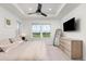Spacious main bedroom with ceiling fan, large windows and TV at 1678 Wright Aly, Erie, CO 80516