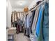 Organized walk-in closet providing ample storage space with hanging racks, drawers, and shelves at 1678 Wright Aly, Erie, CO 80516