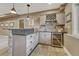 This bar area features a granite countertop, tile backsplash, wine storage, and pendant lighting at 17015 Oxbridge Rd, Monument, CO 80132