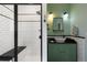 Stylish bathroom featuring a subway tile shower and vintage-inspired vanity at 17015 Oxbridge Rd, Monument, CO 80132