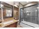 Bathroom featuring granite countertop vanity and tiled shower/tub at 17015 Oxbridge Rd, Monument, CO 80132