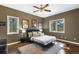 Comfortable bedroom with multiple windows offering natural light and scenic views at 17015 Oxbridge Rd, Monument, CO 80132
