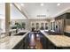 Spacious kitchen with granite countertops, stainless steel appliances, and an island cooktop at 17015 Oxbridge Rd, Monument, CO 80132