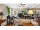 Inviting living room with a cozy fireplace, plush seating, and abundant natural light creates a warm and comfortable atmosphere at 17015 Oxbridge Rd, Monument, CO 80132