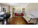 Cozy living room with fireplace, piano, and sofa at 17015 Oxbridge Rd, Monument, CO 80132