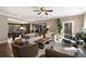 Open-concept living room features hardwood floors, neutral decor, and ample seating, creating a welcoming space at 17015 Oxbridge Rd, Monument, CO 80132