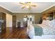 Spacious primary bedroom with hardwood floors and ensuite access at 17015 Oxbridge Rd, Monument, CO 80132