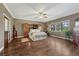 Large bedroom featuring hardwood floors, ceiling fan and ample natural light at 17015 Oxbridge Rd, Monument, CO 80132