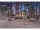Expansive home with a stone patio, outdoor kitchen, fireplace and spacious deck at 17015 Oxbridge Rd, Monument, CO 80132