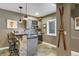Wet bar area with stone accents, wine rack, and seating at 17015 Oxbridge Rd, Monument, CO 80132