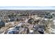 Aerial view of a residential neighborhood during winter, featuring houses and snowy streets at 17364 W 63Rd Dr, Arvada, CO 80403