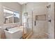 Elegant bathroom with soaking tub and walk-in shower at 17364 W 63Rd Dr, Arvada, CO 80403