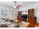 Relaxing Gathering room with hardwood floors and a ceiling fan at 17364 W 63Rd Dr, Arvada, CO 80403