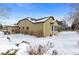 House exterior, side view, showing snow covered yard at 17364 W 63Rd Dr, Arvada, CO 80403