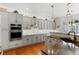 Modern kitchen with gray cabinets and granite countertops at 17364 W 63Rd Dr, Arvada, CO 80403