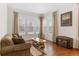 Living room with hardwood floors and large windows at 17364 W 63Rd Dr, Arvada, CO 80403