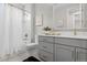 Well-lit bathroom with a shower featuring stylish tile, a modern vanity, and a clean, contemporary design at 890 Coal Bank Trl, Castle Rock, CO 80104