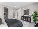 Comfortable bedroom with a dark wood accent cabinet, sliding door, and a well-lit, relaxing atmosphere at 890 Coal Bank Trl, Castle Rock, CO 80104