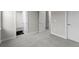 Hallway and doorway of a home with neutral walls and plush gray carpet at 890 Coal Bank Trl, Castle Rock, CO 80104