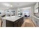 Modern open-concept kitchen with an island, dining space and view to the living room at 890 Coal Bank Trl, Castle Rock, CO 80104