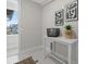 Functional mudroom with a white table, decorative basket, and convenient access to the outdoors at 890 Coal Bank Trl, Castle Rock, CO 80104