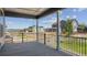 Covered patio with black iron railing and a view of the community at 890 Coal Bank Trl, Castle Rock, CO 80104