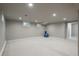 Spacious finished basement with carpet flooring, recessed lighting, and a bright feel at 5164 E Princeton Ave, Cherry Hills Village, CO 80113