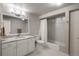 Bathroom featuring modern fixtures, granite counters, a tub and ample lighting at 5164 E Princeton Ave, Cherry Hills Village, CO 80113