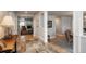 Inviting foyer with decorative tiled flooring, leading to the living room with a fireplace and hardwood floors at 5164 E Princeton Ave, Cherry Hills Village, CO 80113