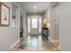 Elegant foyer featuring decorative tiled flooring and a glass front door, providing a welcoming entrance to the home at 5164 E Princeton Ave, Cherry Hills Village, CO 80113