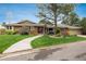 Charming one-story brick home with a well-manicured lawn, mature trees, and a welcoming stone walkway at 5164 E Princeton Ave, Cherry Hills Village, CO 80113