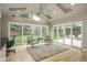 Bright living area featuring vaulted ceilings, skylights, hardwood floors, and backyard views at 5164 E Princeton Ave, Cherry Hills Village, CO 80113