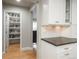 Walk-in pantry with ample shelving providing generous storage space for food and kitchen essentials at 5164 E Princeton Ave, Cherry Hills Village, CO 80113