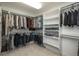 A large walk-in closet with ample hanging space, shelving, and convenient storage solutions at 5164 E Princeton Ave, Cherry Hills Village, CO 80113